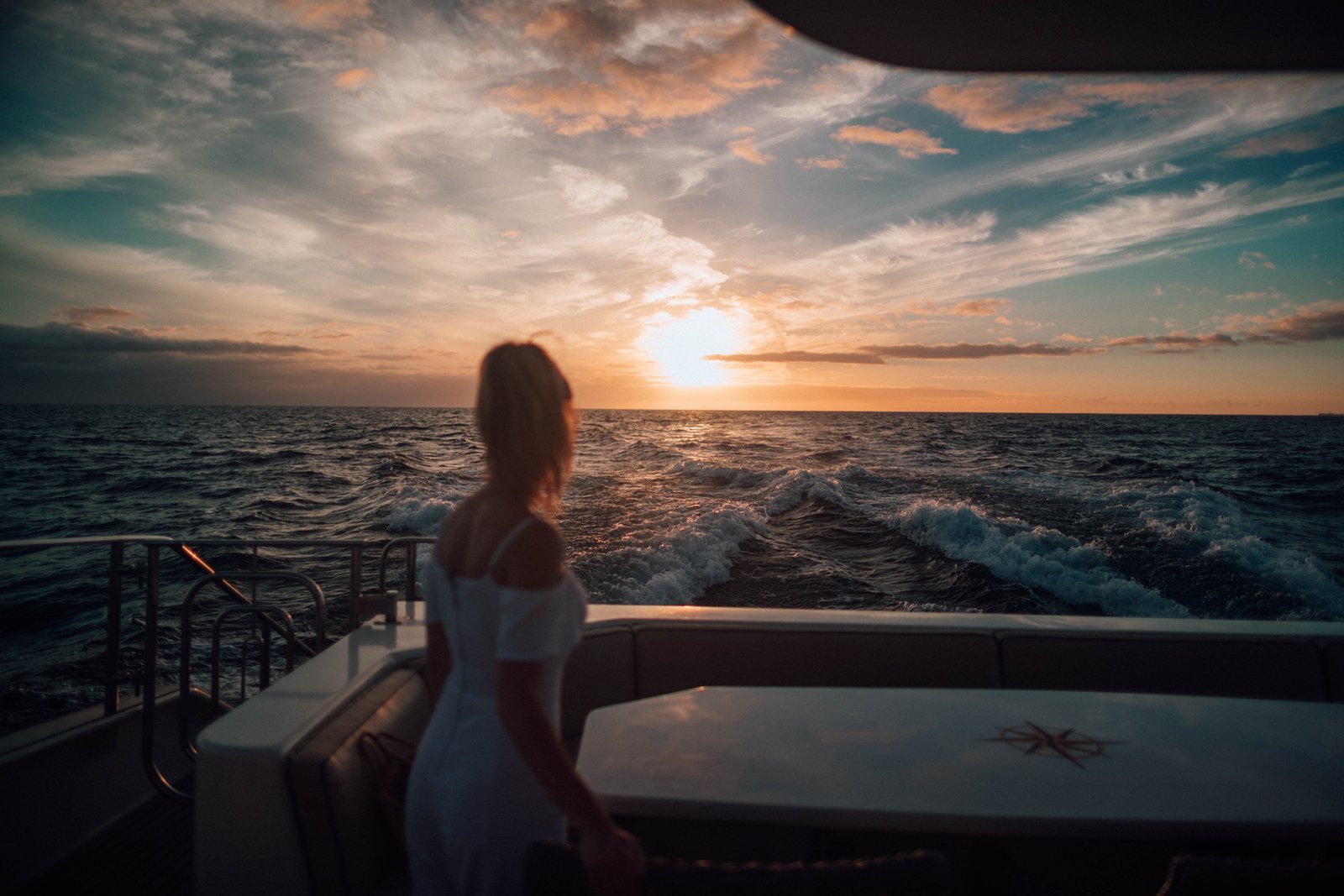 Watching the sunset from the stern of a yacht
